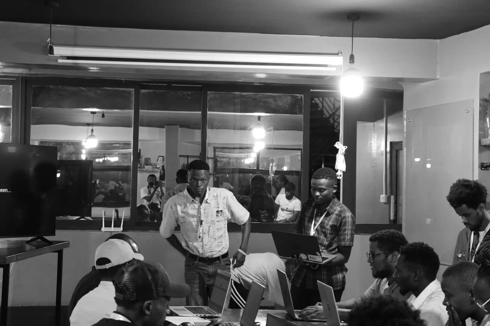 A host speaking to a room of builders.
