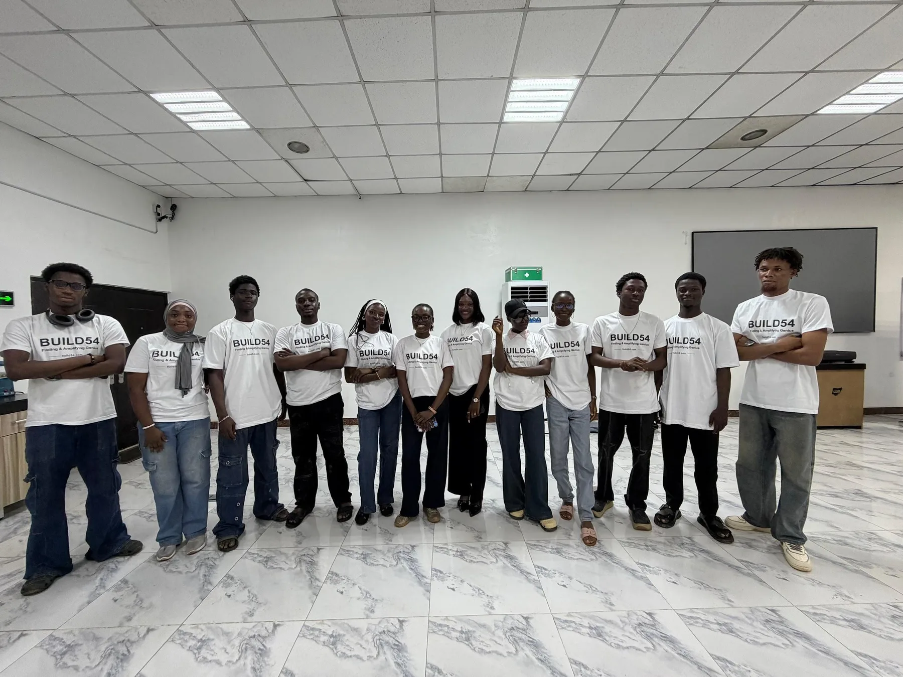The Build Zero crew at UNILAG standing in a line in Build54 T-shirts