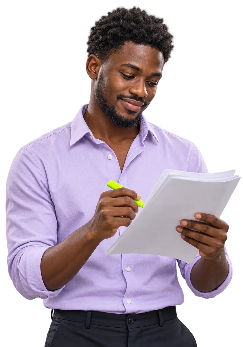 A postgraduate highlighting a printed research paper